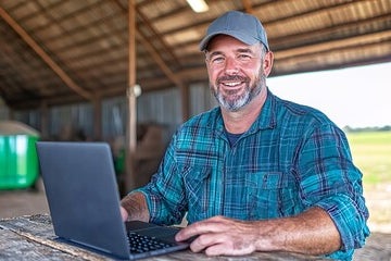 man on laptop outside